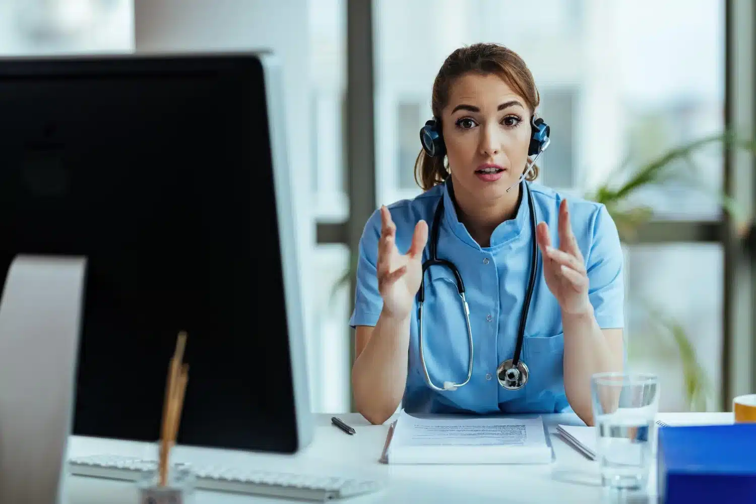 Female nurse with her headset in hospital